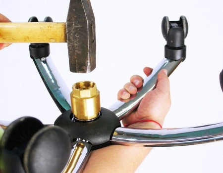 Removing a gas lift cylinder from an office chair base